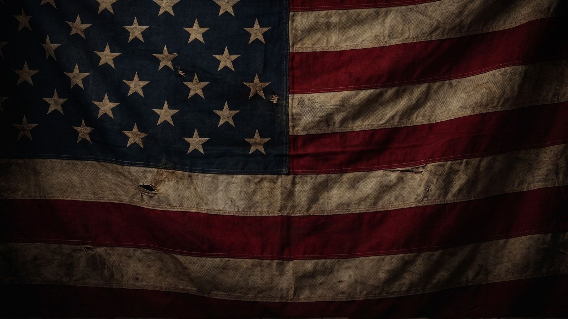 Dark textured background with an American flag design behind Blackout Coffee products