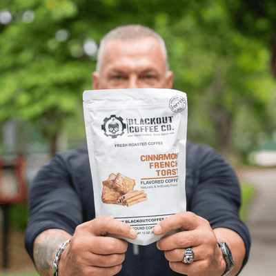 cinnamon french toast man holding the coffee bag