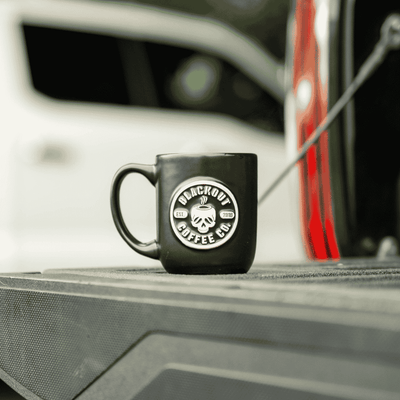 coffee mug on the back of the truck