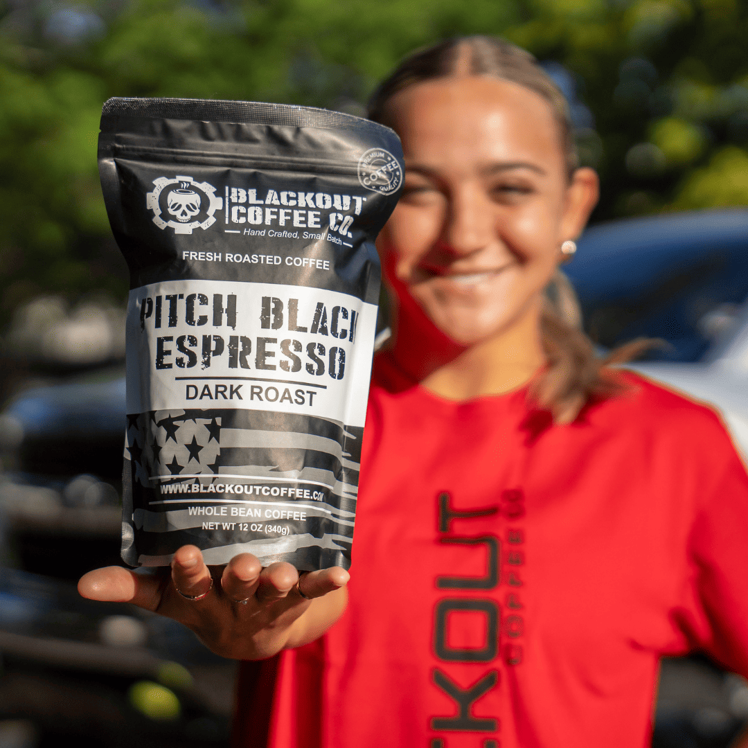 pitch black expresso girl holding the coffee bags