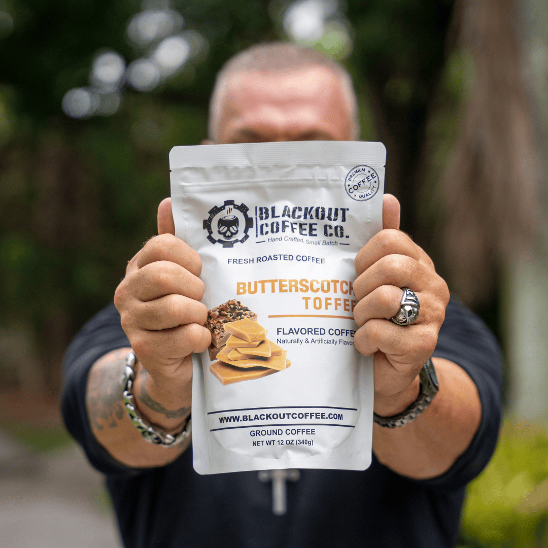 butter scotch man holding the coffee