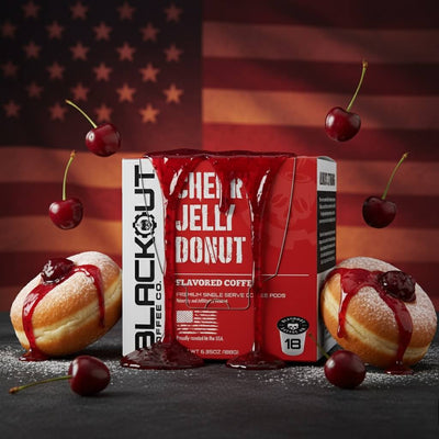 Blackout Coffee Co. Cherry Jelly Donut with donuts and cherries on a dark background.
