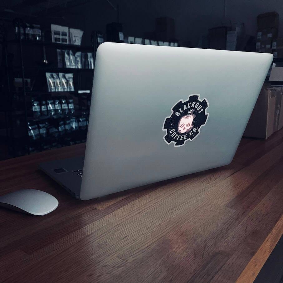 Blackout Coffee Logo Vinyl Decal on MacBook Pro