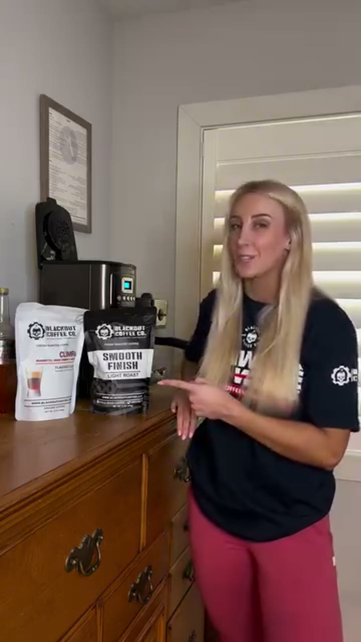 Blackout Coffee customer presenting two coffee bags beside a home brewer